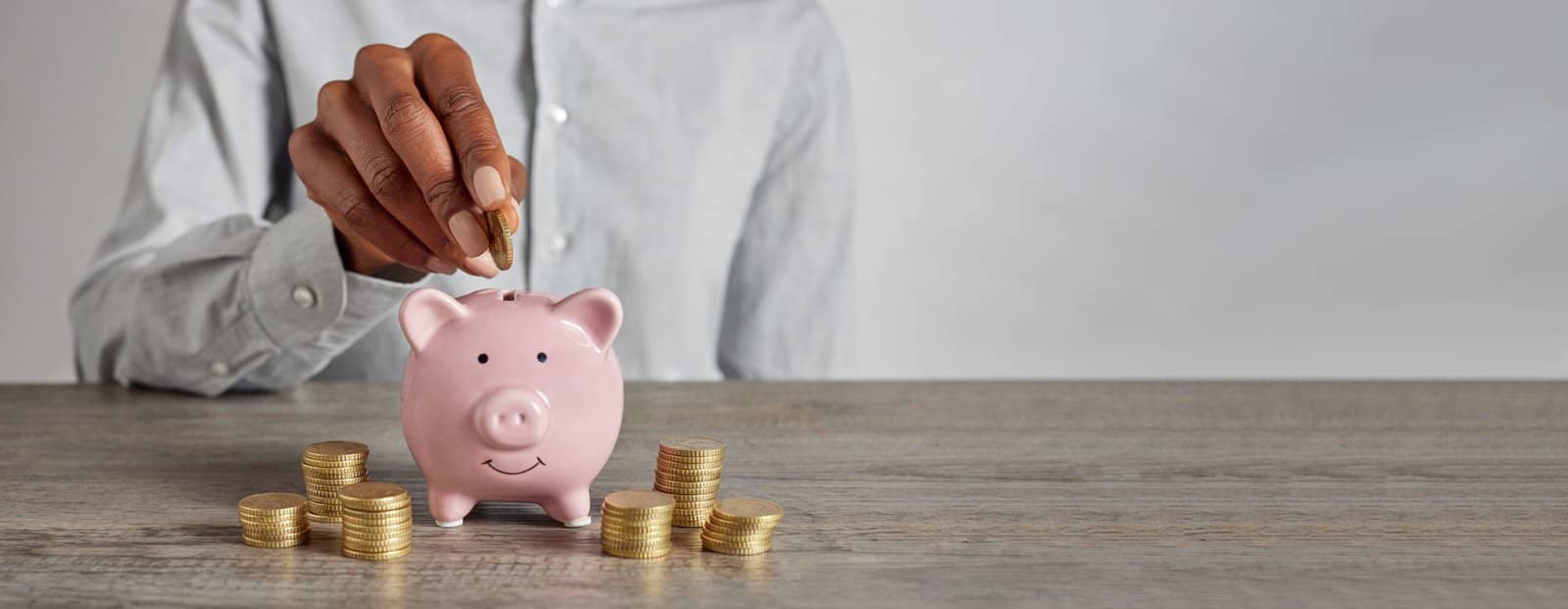 Putting coins in a piggy bank